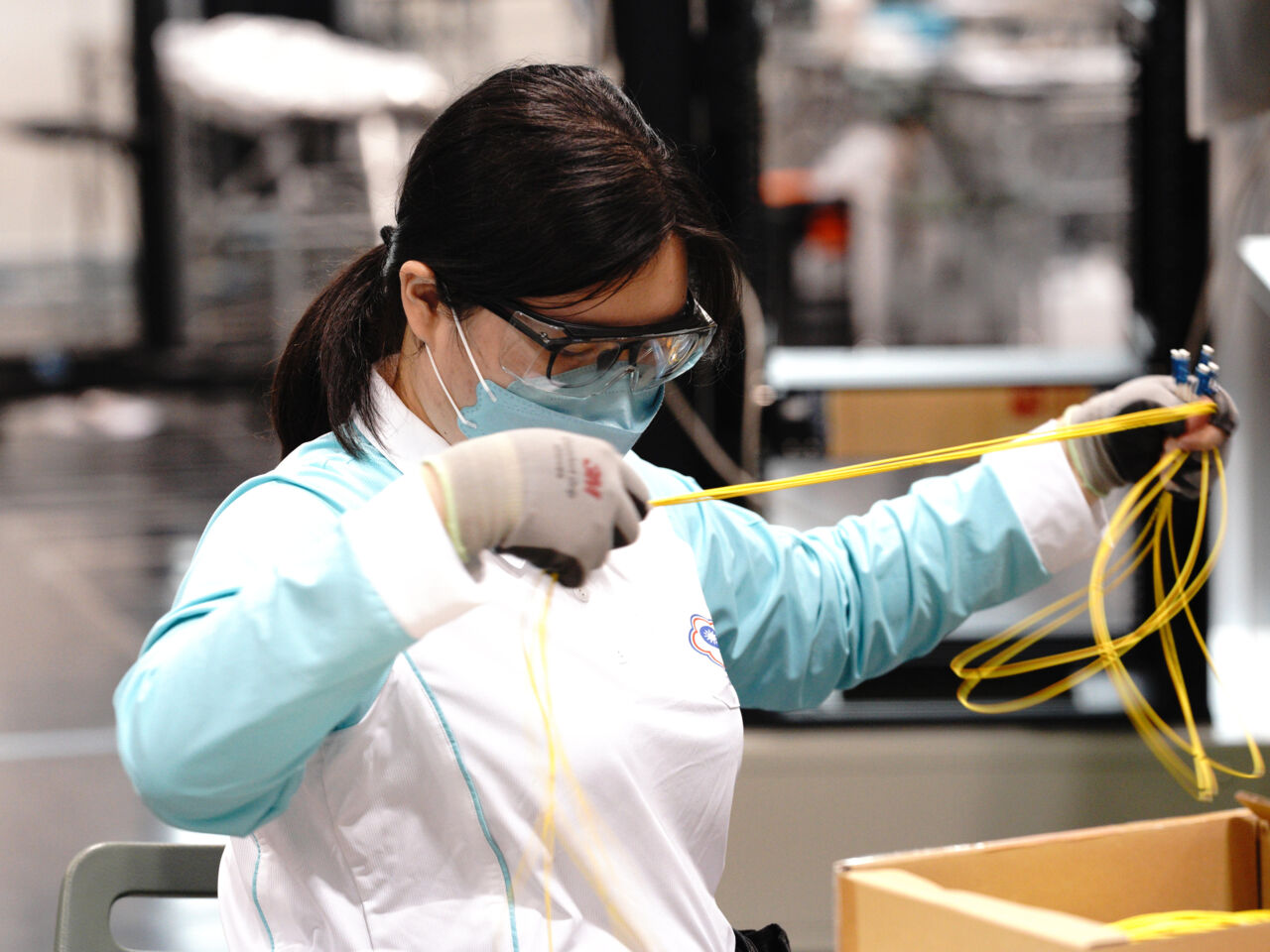 A female competitor holds up wire during WorldSkills Competition 2022 Special Edition in Kyoto, Japan from 15-18 October 2022.
