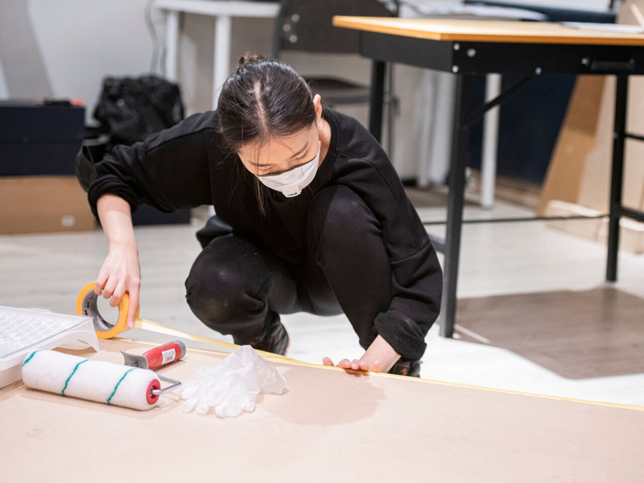 A competitor from Kazakhstan prepares a board for painting with protective tape as part of the Visual Merchandising competition which took place from 14 to 17 October 2022 in Stockholm, Sweden.
