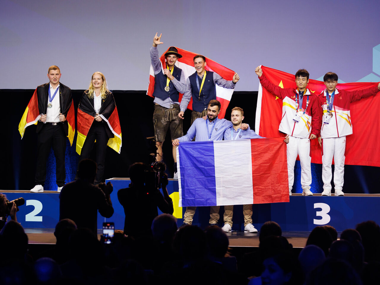 Competitors on the podium at the closing ceremony on 27 November at Messezentrum Salzburg.