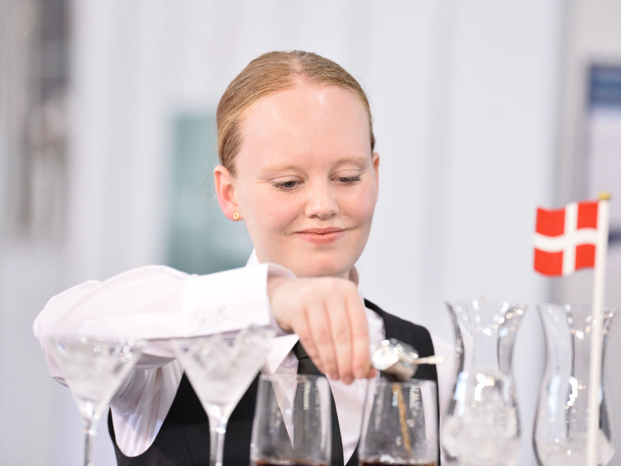 A restaurant service competitor from Denmark at WorldSkills Kazan 2019.